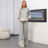 Completo versatile da donna composto da top girocollo in jacquard e pantaloni a gamba larga